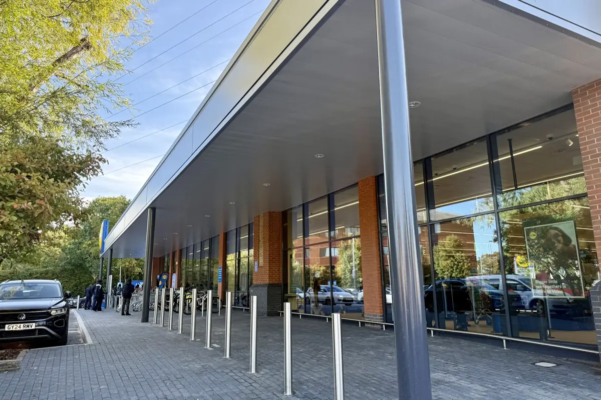 The entrance canopy soffit and shopfront glazing at Lidl Crawley
