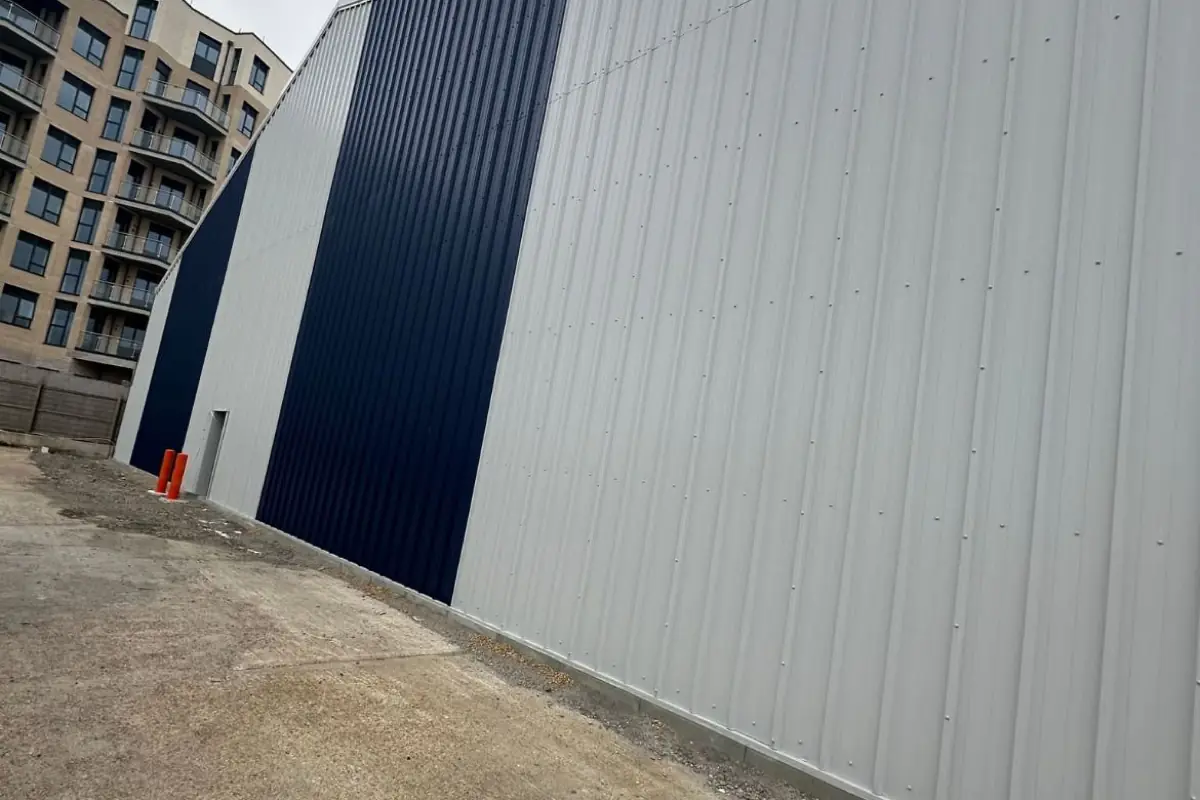 A navy and silver profiled cladding elevation on a new industrial unit