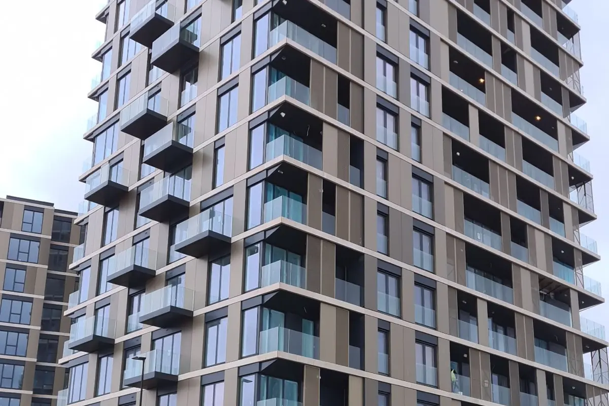 A residential tower finished in bronze composite panels